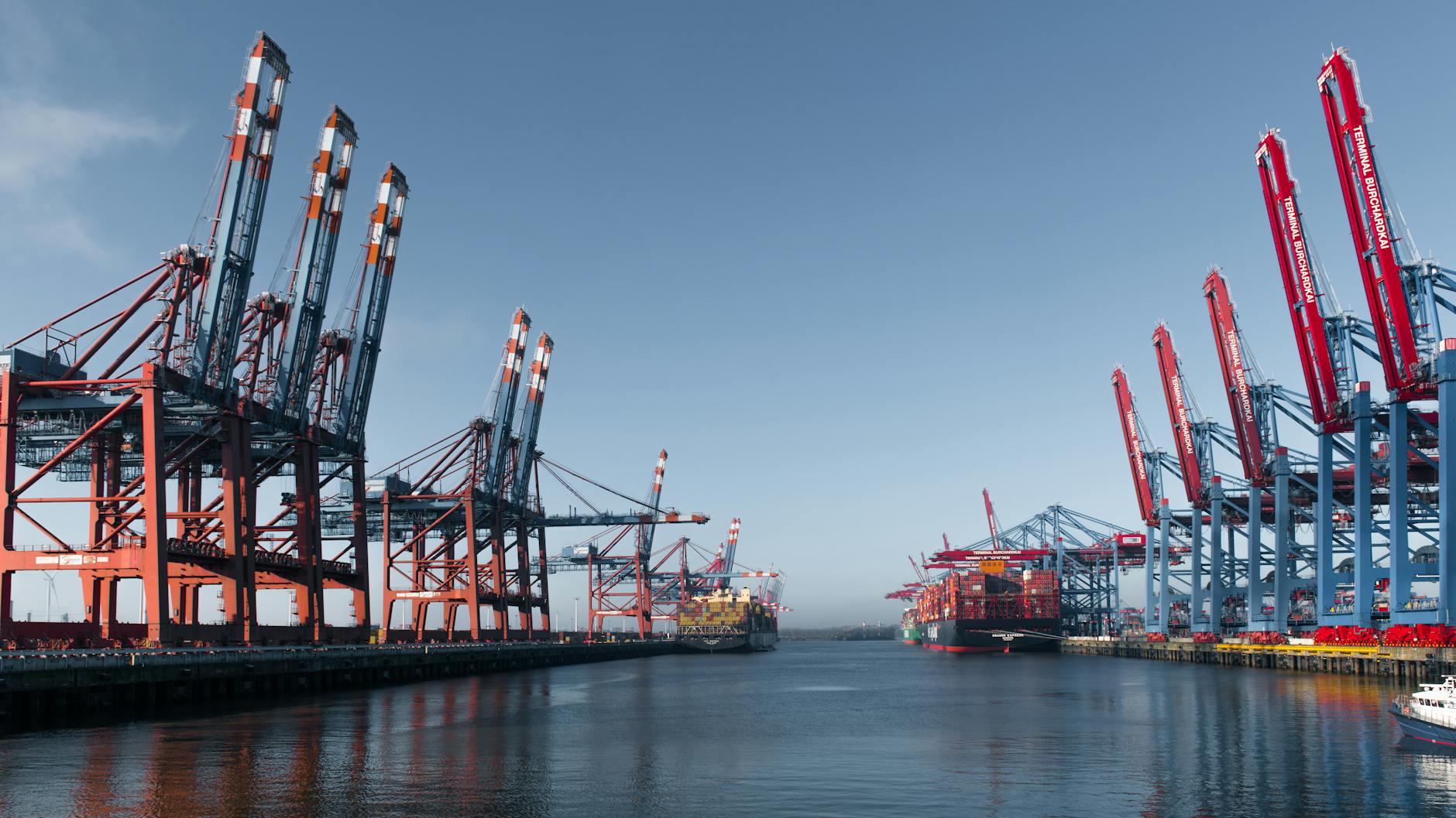 container terminal at hamburg harbor under clear sky