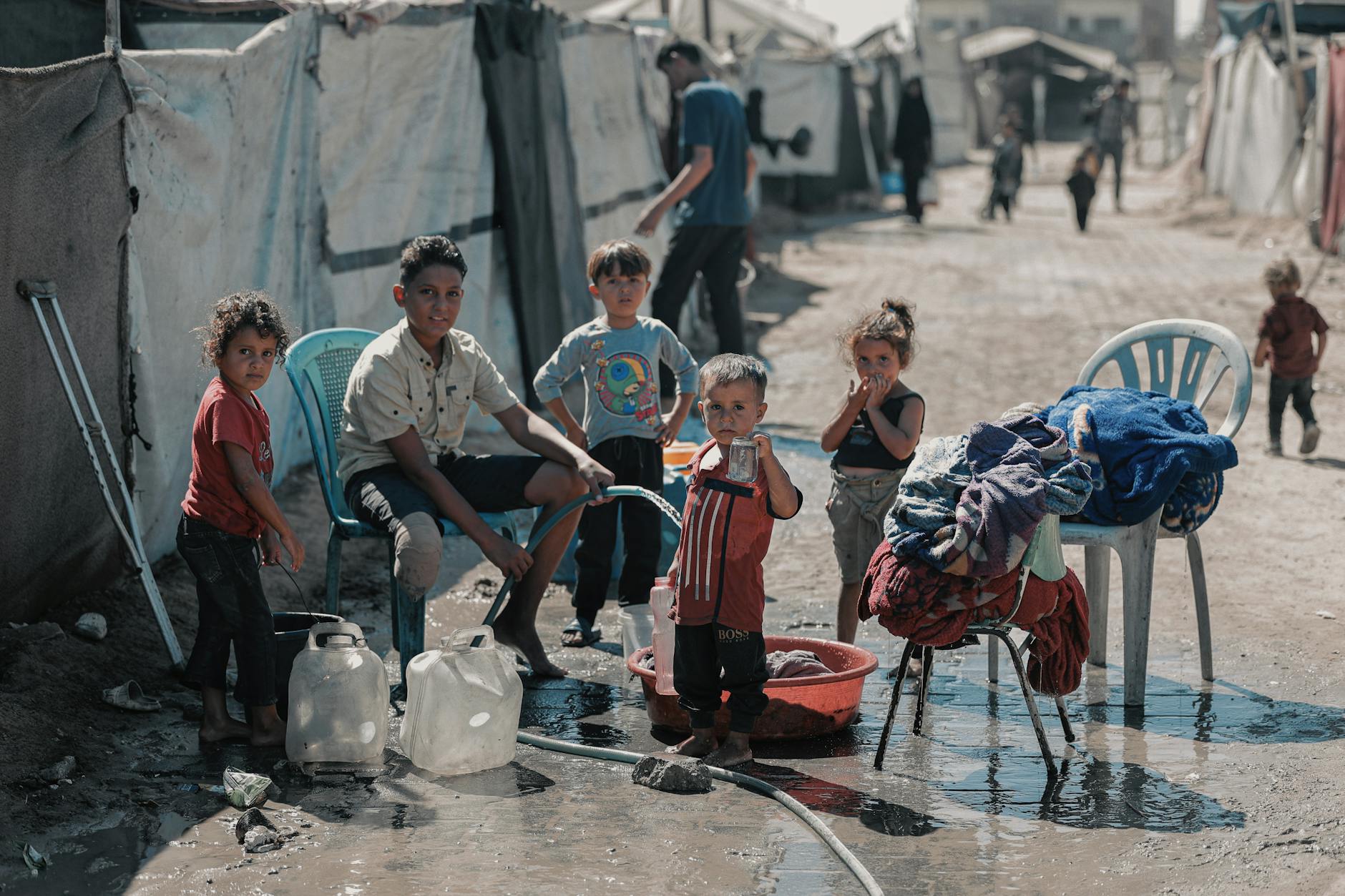 The Moral Blind Spots of Some Anti‑Abortion Activists in the Context of Gaza and the West Bank... children collecting water in gaza refugee camp